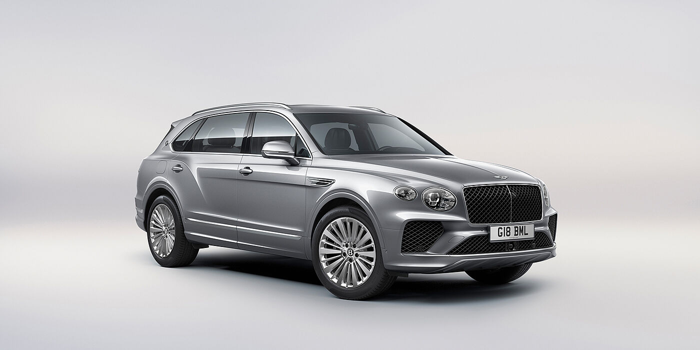 Bentley Lugano Bentley Bentayga Extended Wheelbase luxury SUV front three quarter view in Moonbeam paint with 21 inch five spoke painted wheels