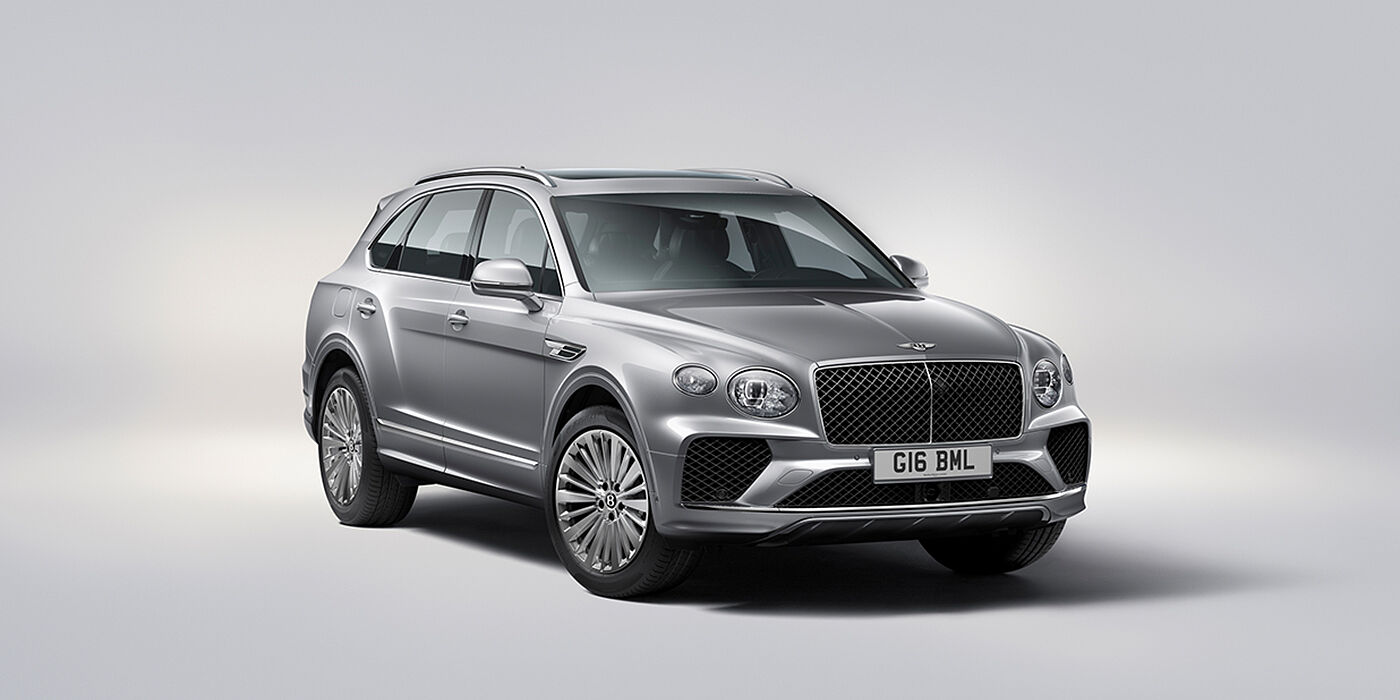 Bentley Lugano Bentley Bentayga luxury SUV front three quarter view in Moonbeam paint with matrix grille and 21″ 5 spoke painted wheels