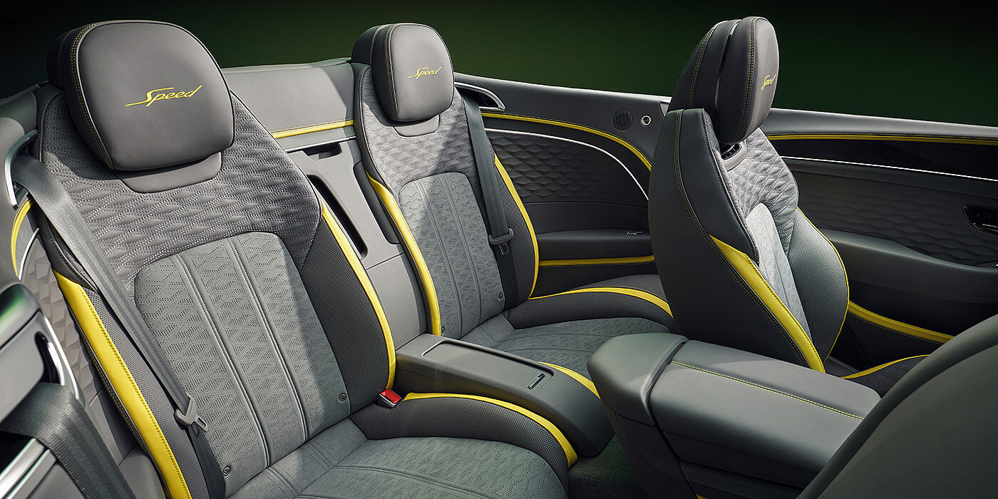 Bentley Lugano Bentley New Continental GTC Speed convertible rear interior with unique Speed colour split in Gravity Grey and Cyber Yellow hide colours, and contrast stitched headrest emblems 